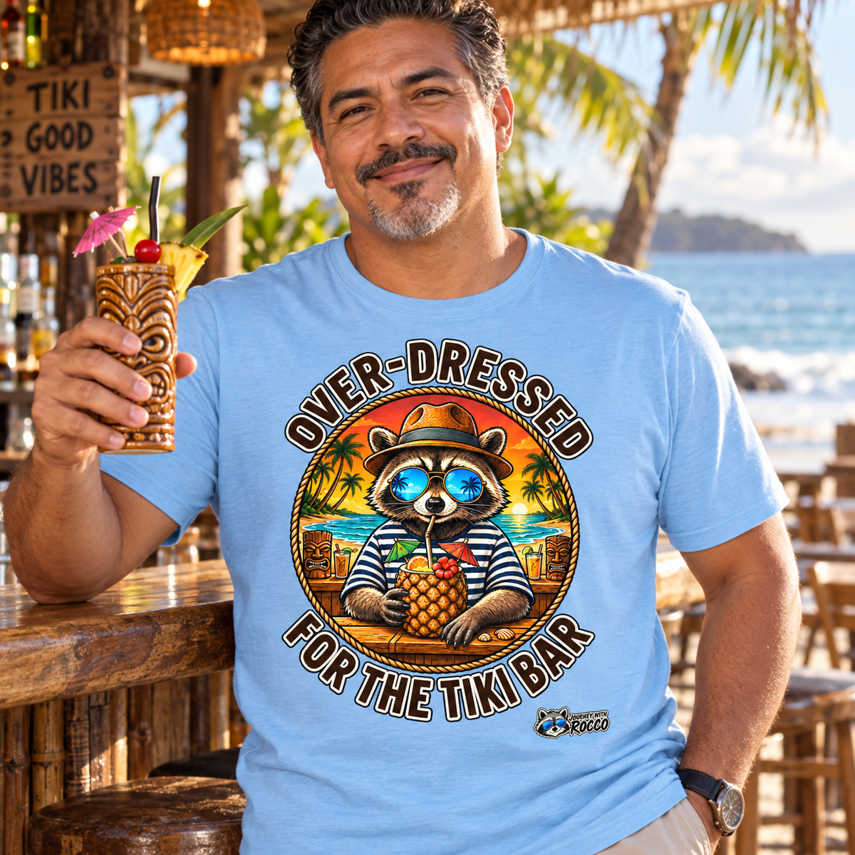 Rocco Raccoon “Over-Dressed for the Tiki Bar” T-Shirt | Retro Tropical Beach Tee | Journey with Rocco Series