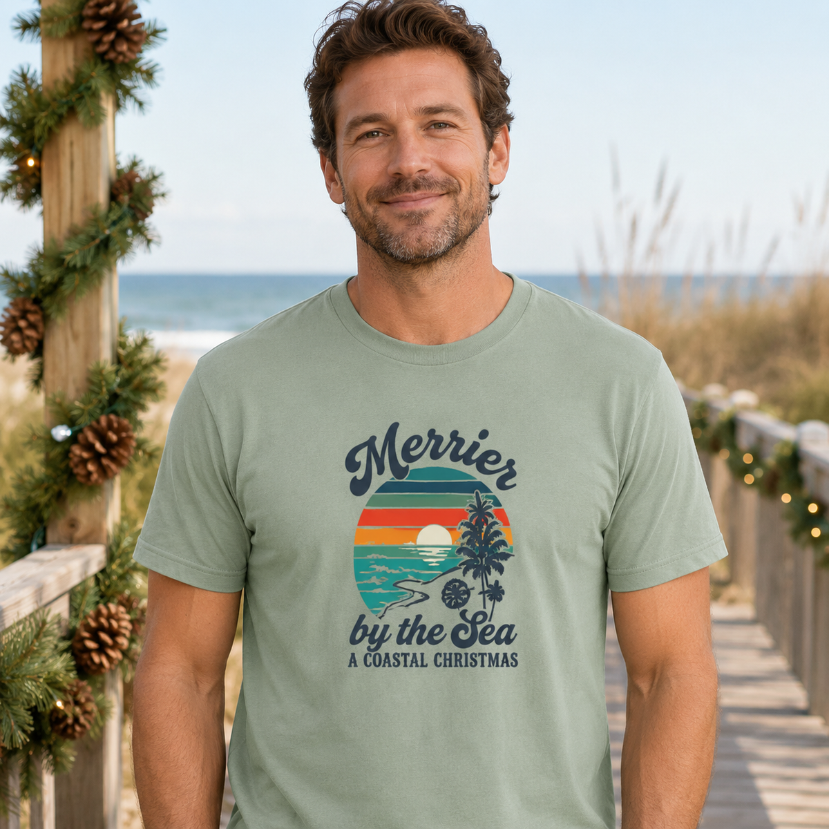 Merrier by the Sea Coastal Christmas T-Shirt | Tropical Sunset Beach Holiday Tee