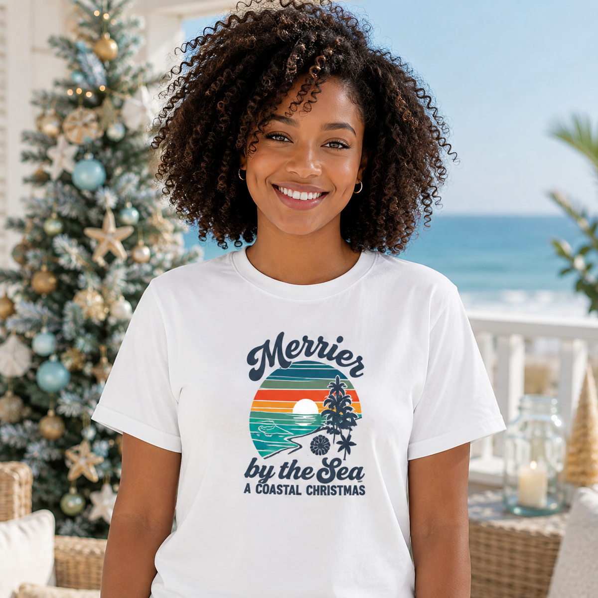 Merrier by the Sea Coastal Christmas T-Shirt | Tropical Sunset Beach Holiday Tee