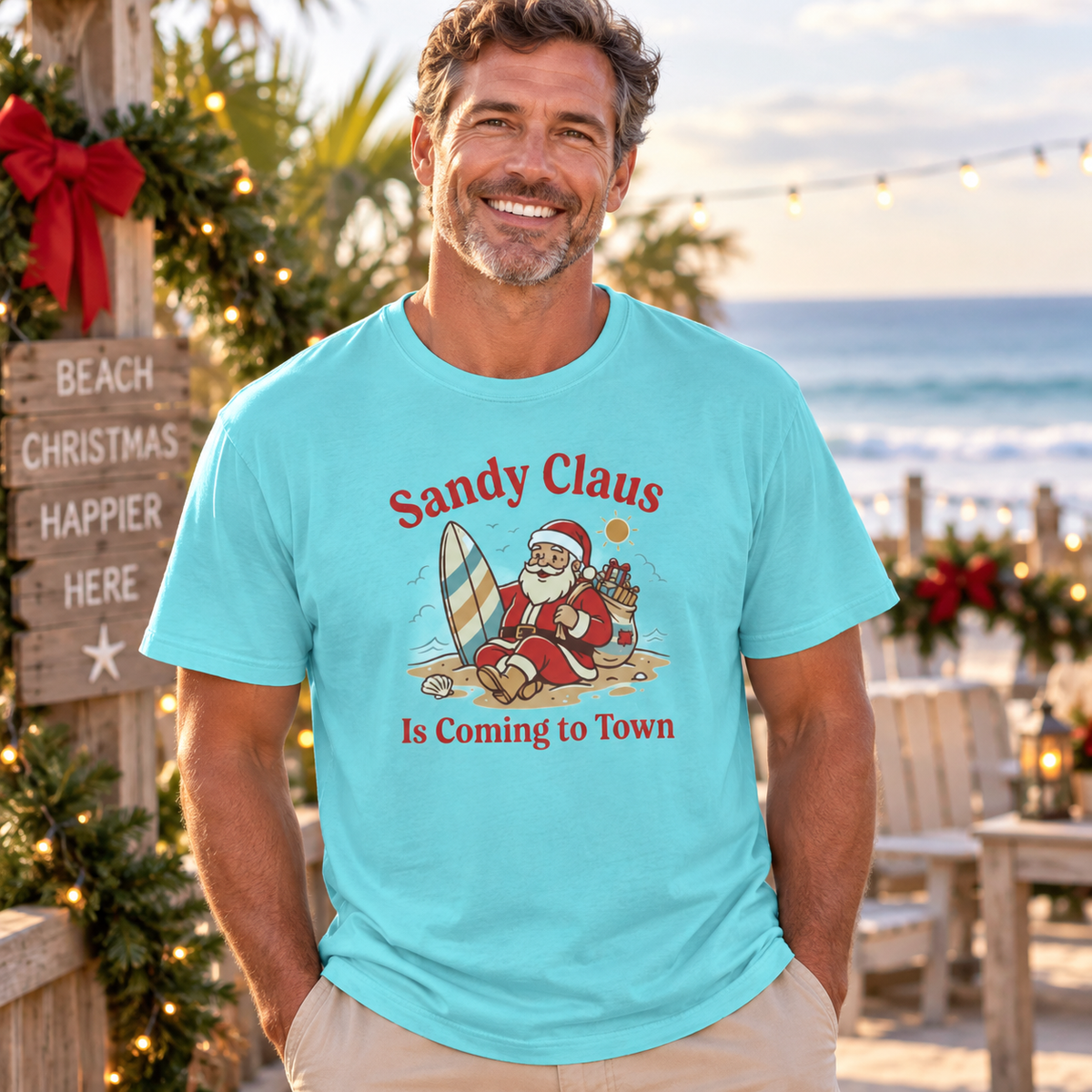 Sandy Claus Is Coming to Town T-Shirt | Funny Surfing Santa Coastal Christmas Tee